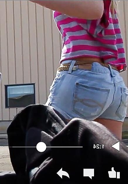 10P Sexy blonde teen bending over in short shorts.