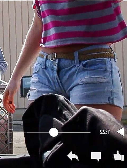 10P Sexy blonde teen bending over in short shorts.