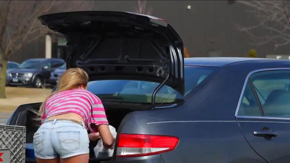 10P Sexy blonde teen bending over in short shorts.