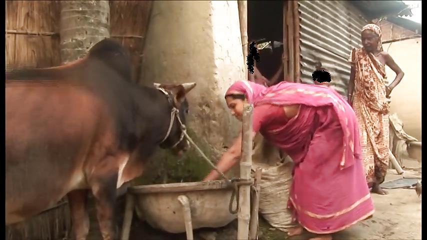 6P Bangladeshi rural woman bending over 