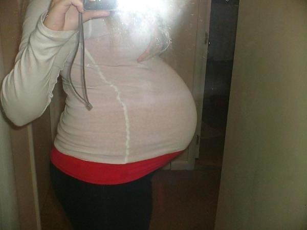 17P Big pregnant belly in tight clothes