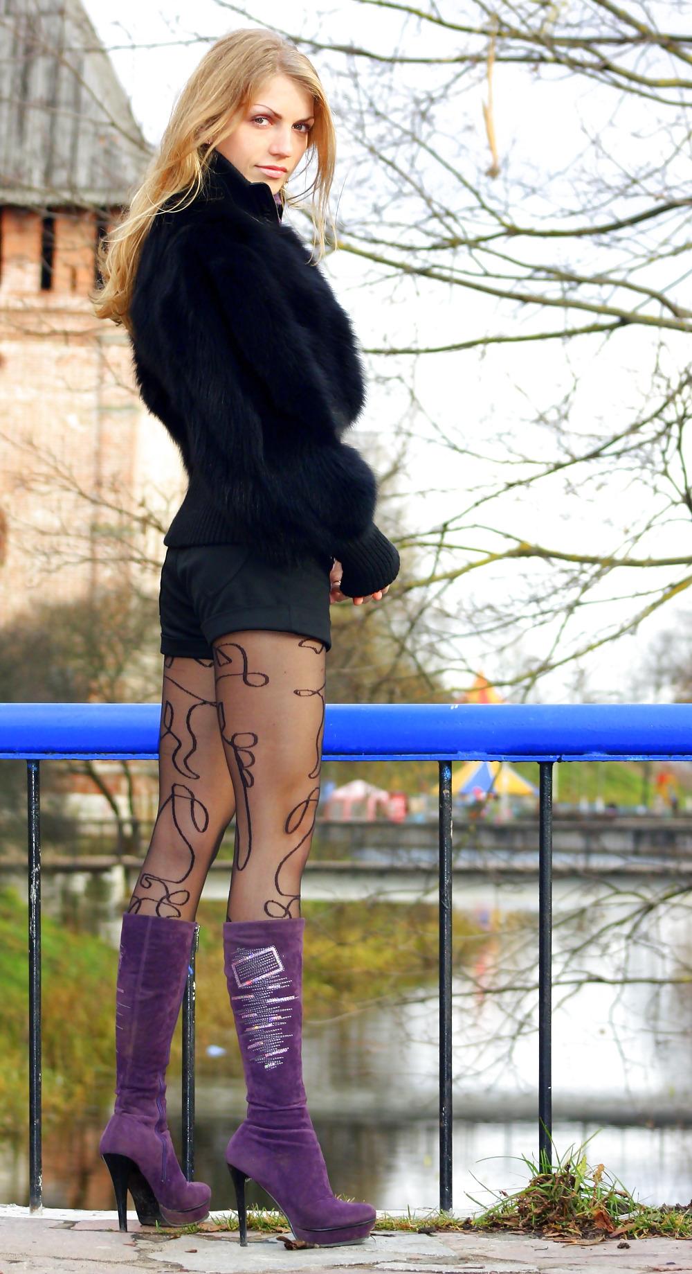 25P The skinny wife in stockings, boots, short skirt.