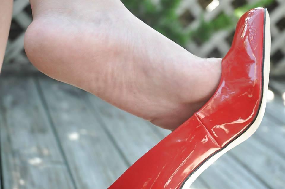 12P Caras red shoe tease and dangle.