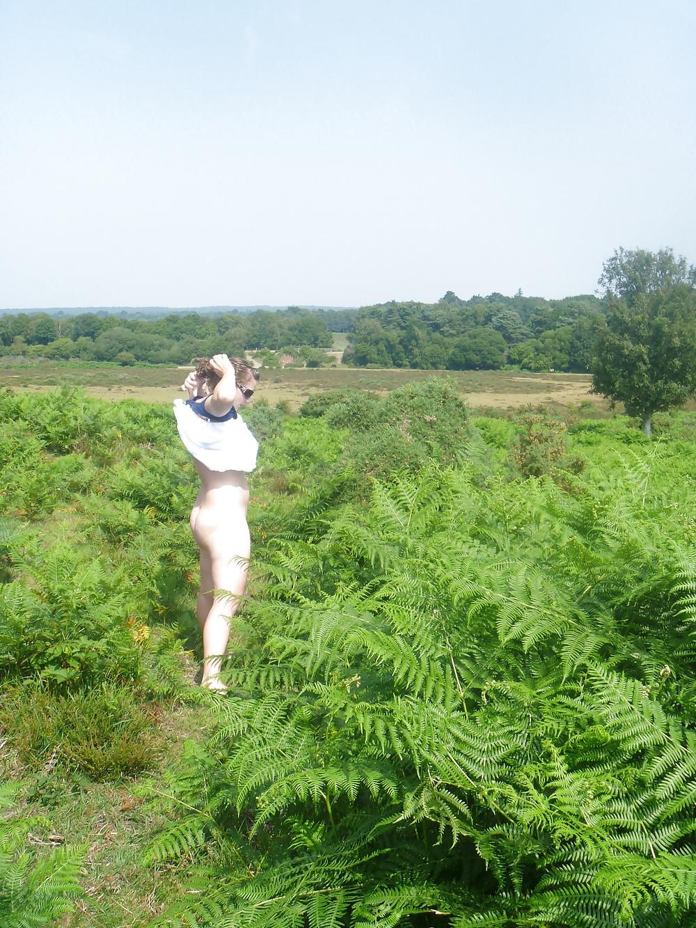 25P Outdoor couple playing in woods New forest dorset uk