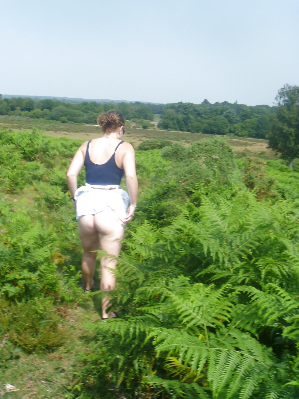25P Outdoor couple playing in woods New forest dorset uk