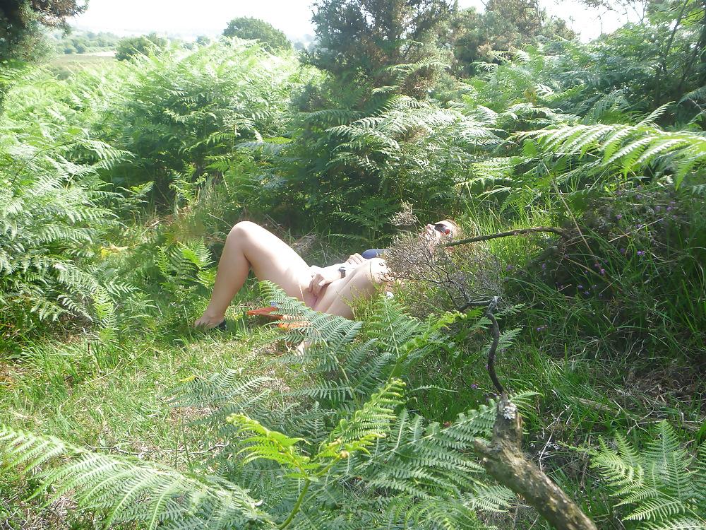 25P Outdoor couple playing in woods New forest dorset uk