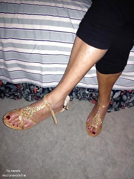 25P Some heels,shoe dangling