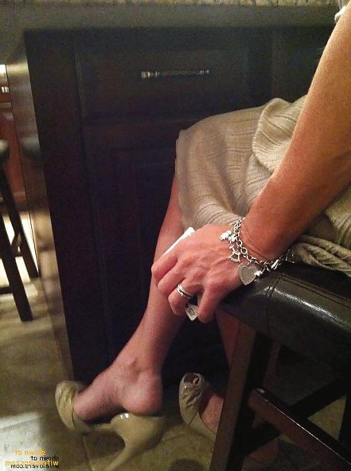 25P Some heels,shoe dangling