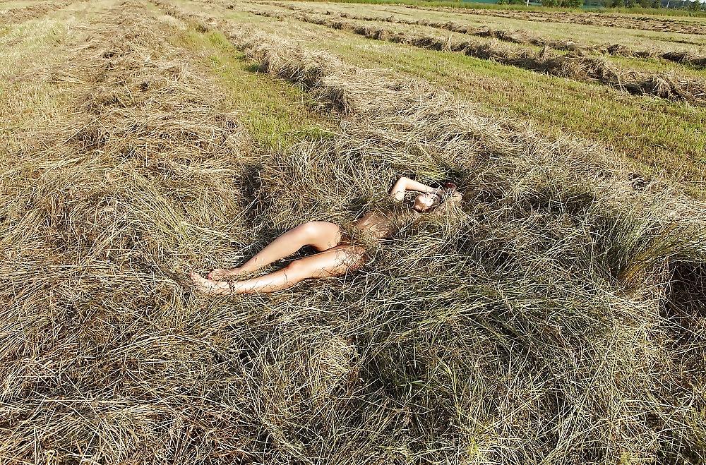 25P Hot brunett teen plays outdoor in the hay