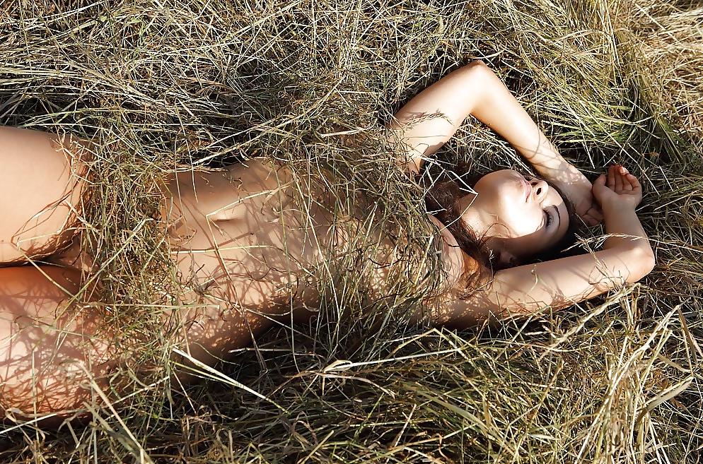 25P Hot brunett teen plays outdoor in the hay