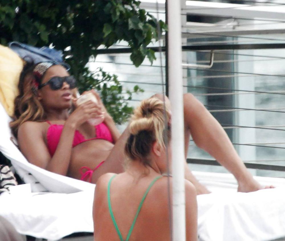 24P Ciara in a pink bikini poolside at her luxury hotel in Miami