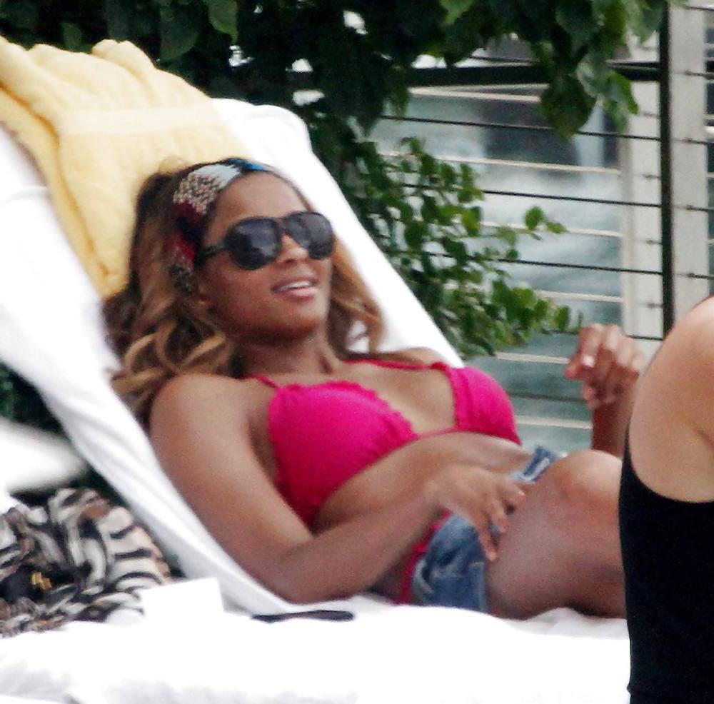 24P Ciara in a pink bikini poolside at her luxury hotel in Miami