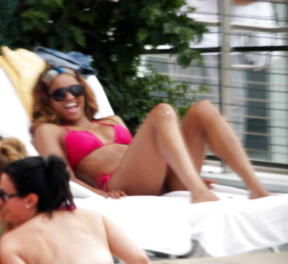 24P Ciara in a pink bikini poolside at her luxury hotel in Miami