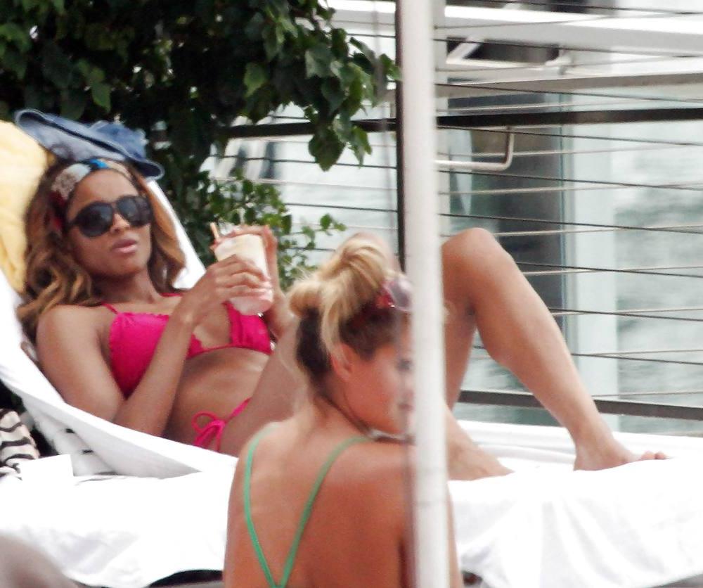 24P Ciara in a pink bikini poolside at her luxury hotel in Miami