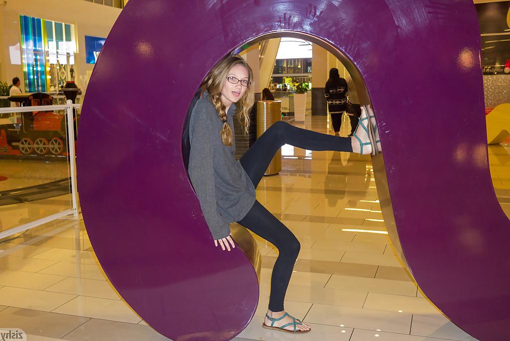 12P Skinny playful blonde teen Reese Berkman bending over in a store