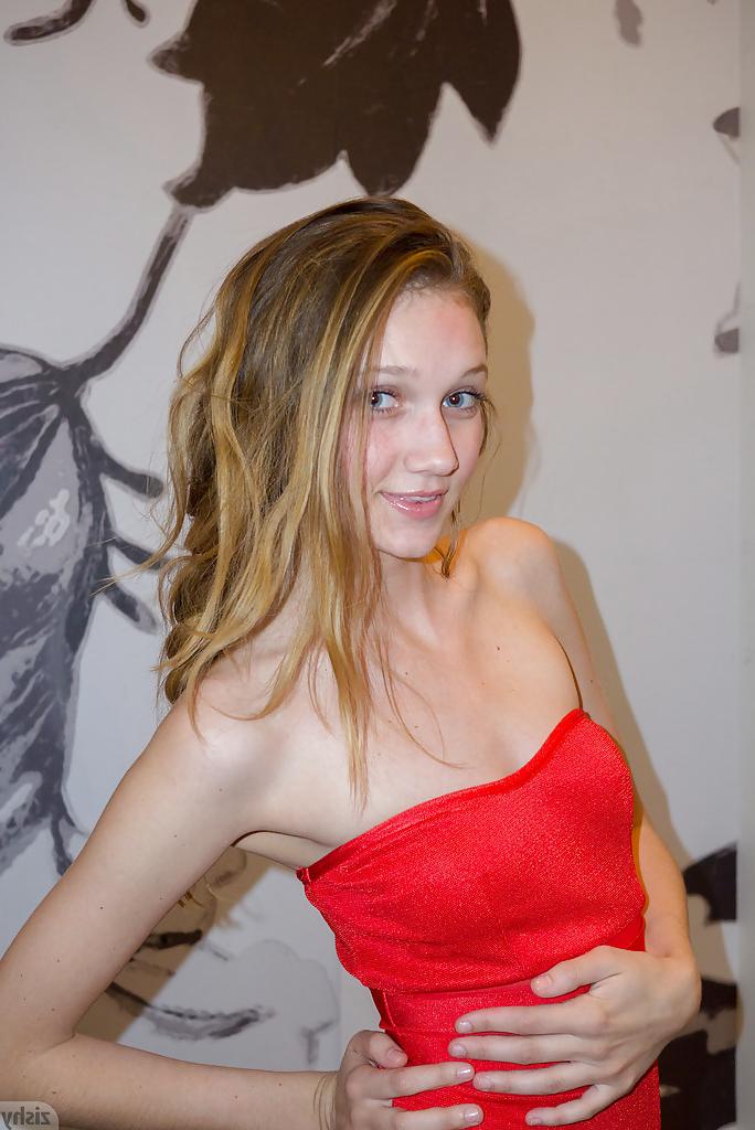 12P Skinny playful blonde teen Reese Berkman bending over in a store