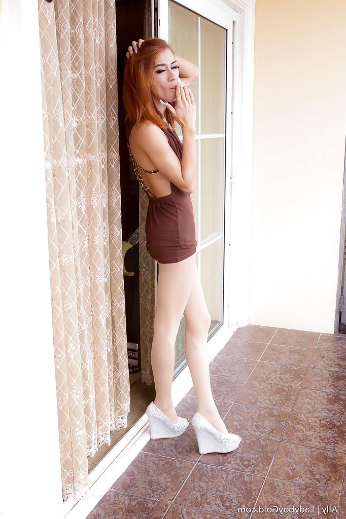 16P Skinny redhead Thai tranny Ally bending over and spreading in heels