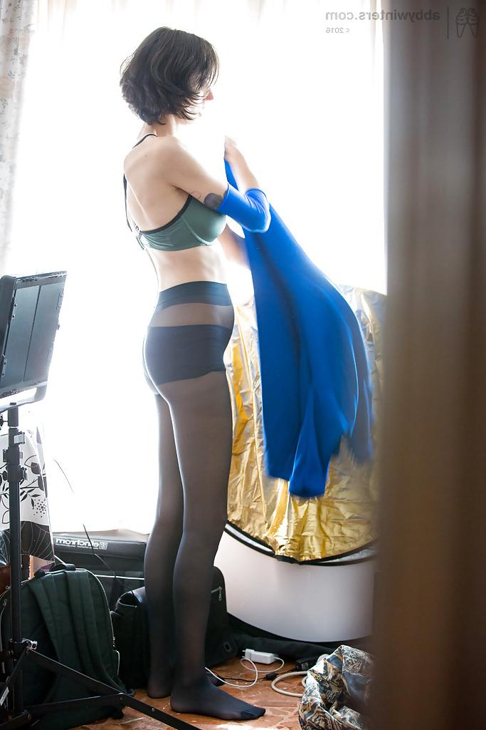 16P Leggy amateur with big tits pulling panties and pantyhose up over ass