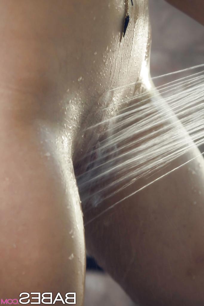 16P Tattooed solo model Jade Nile letting water run over nice tits in shower