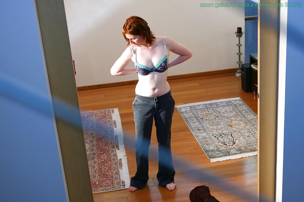 16P Hidden camera captures all natural redhead pulling panties over nice ass
