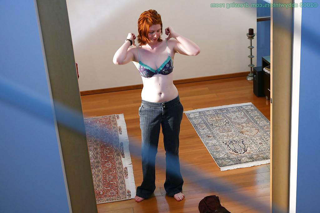 16P Hidden camera captures all natural redhead pulling panties over nice ass