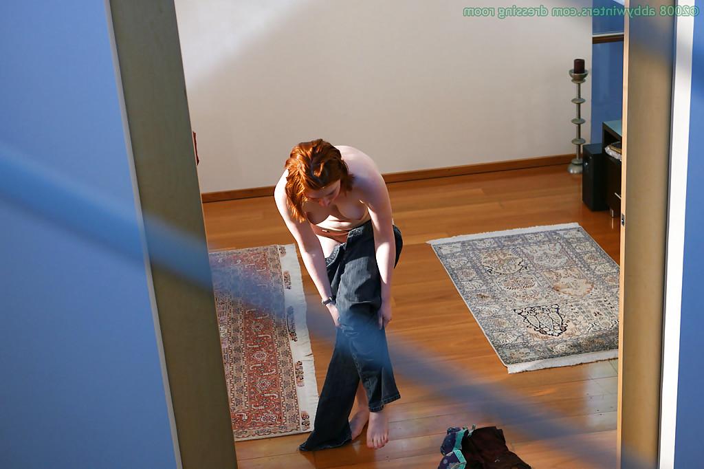 16P Hidden camera captures all natural redhead pulling panties over nice ass