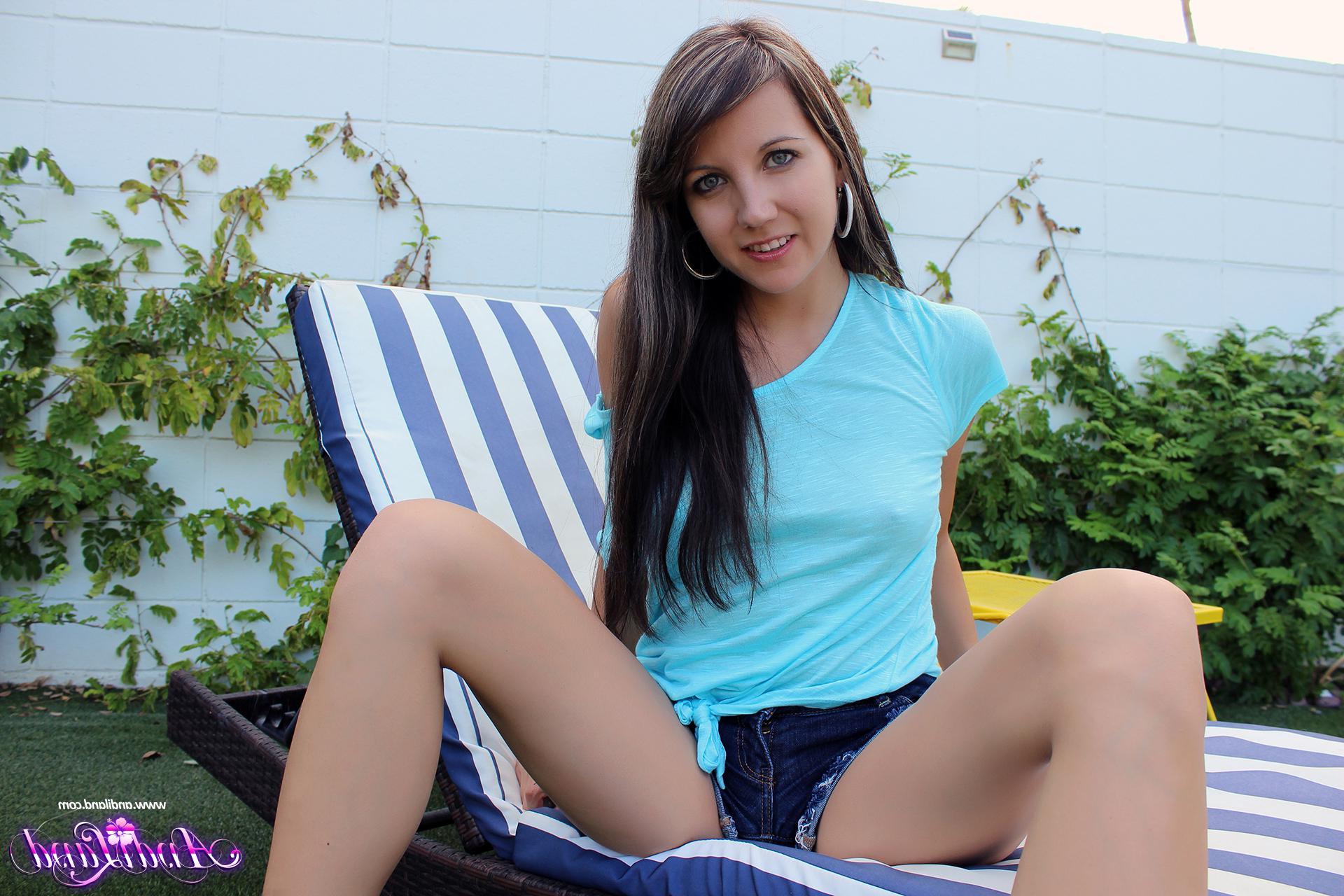15P Andi Land pulls down her shorts to show you her tight pussy in "Bend Me Over"