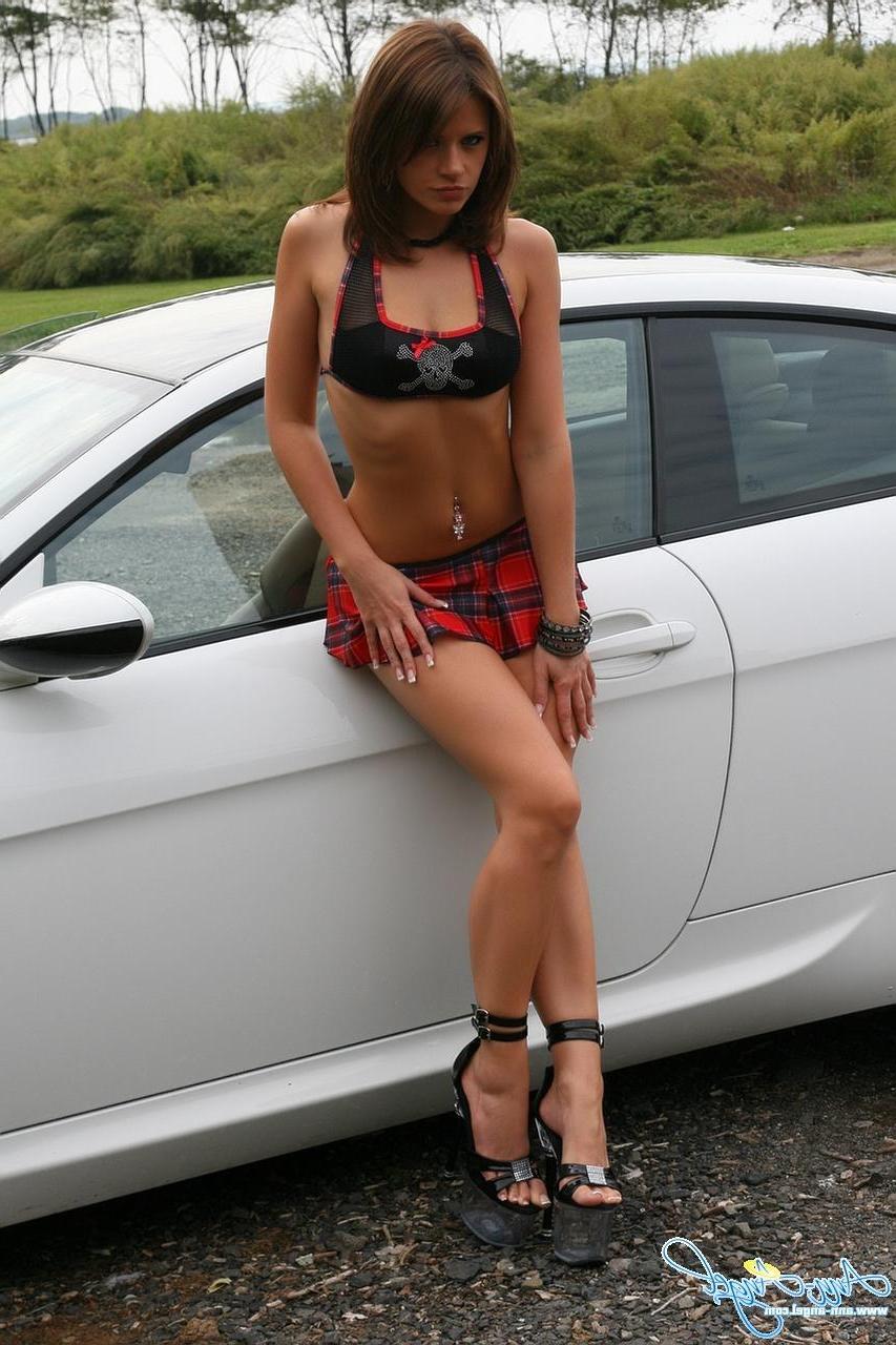 16P Pictures of Ann Angel flaunting her incredible body with a car