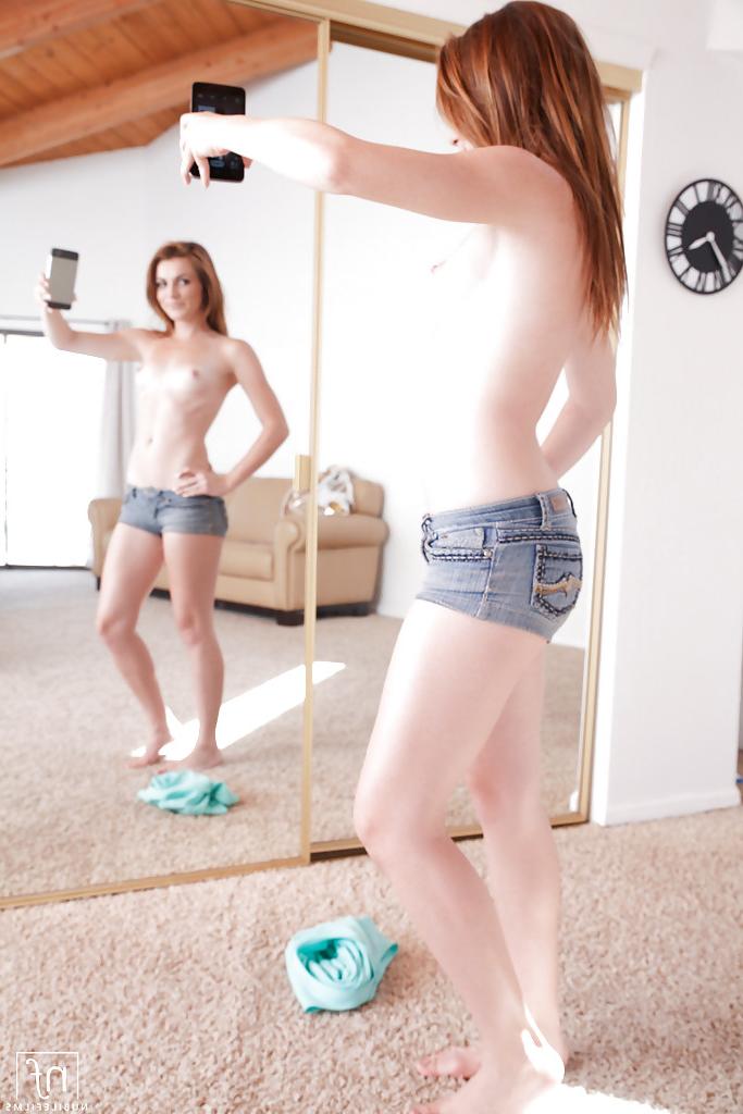 16P Undressing teen babe Emma Stoned shows off her tiny tits in shorts