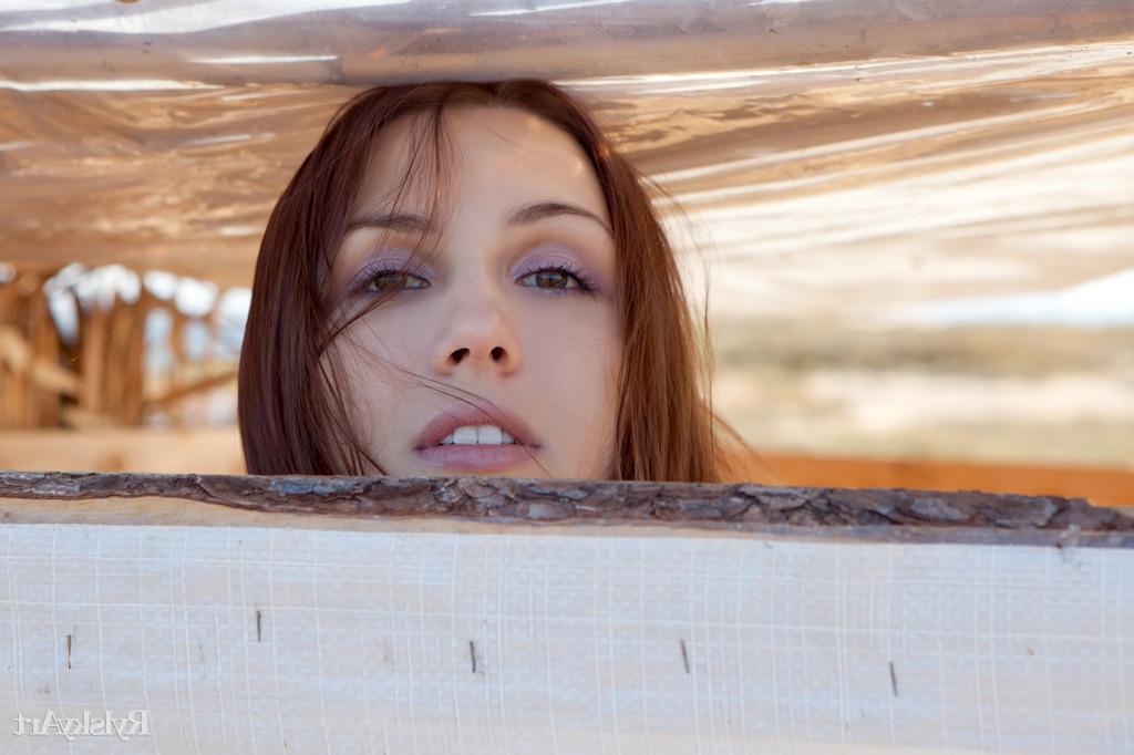 16P Gemma's natural beauty, carefree allure, and spontaneous personality stand out as she happily hangs out and poses in a shack by the beach.