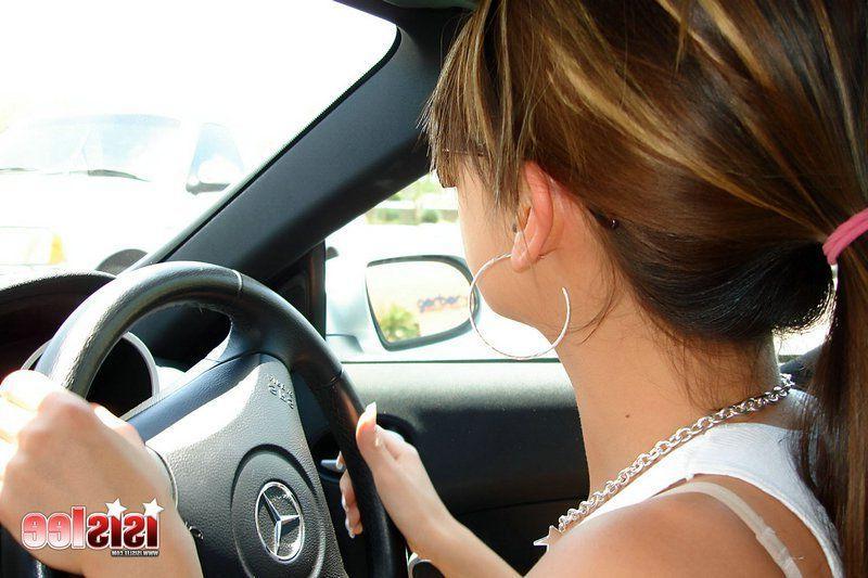 14P Pictures of teen girl Isis Lee showing her pussy in a sports car