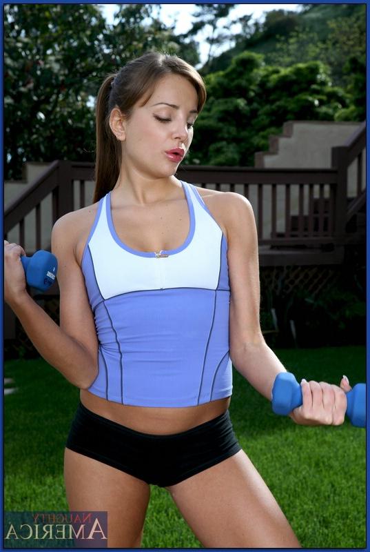 16P Sporty babe Nika Noir denudes her tight booty and twat from shorts