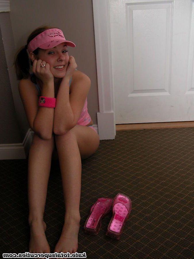 20P Pictures of teen cutie Katie being a tease in a hotel hallway