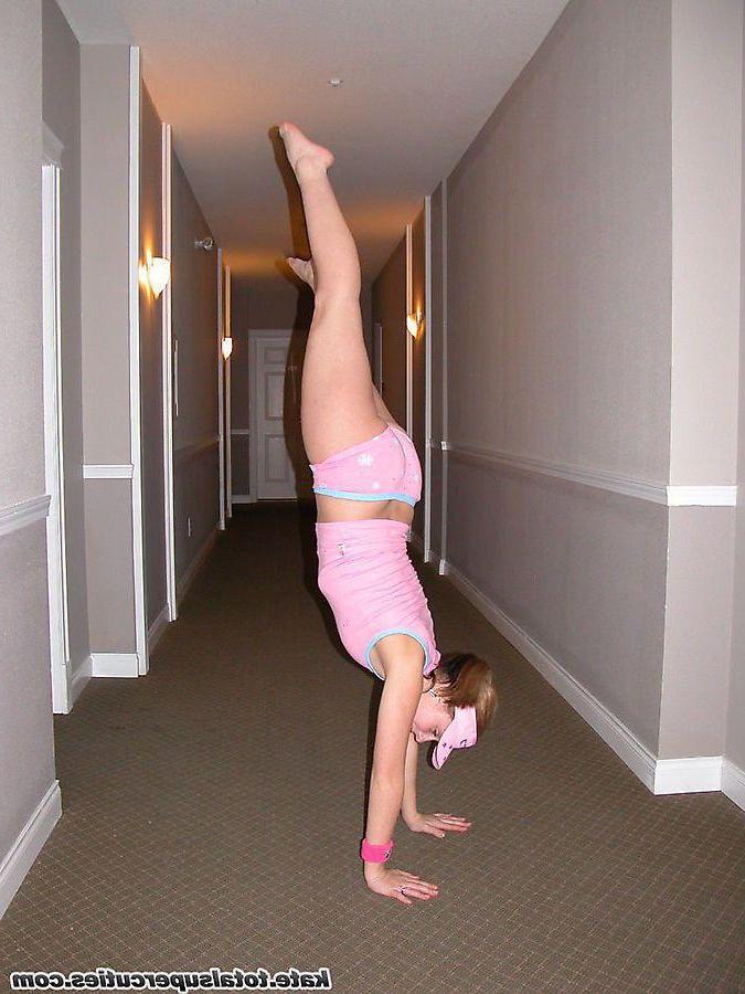 20P Pictures of teen cutie Katie being a tease in a hotel hallway