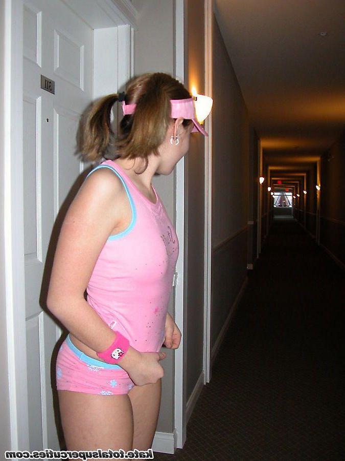 20P Pictures of teen cutie Katie being a tease in a hotel hallway
