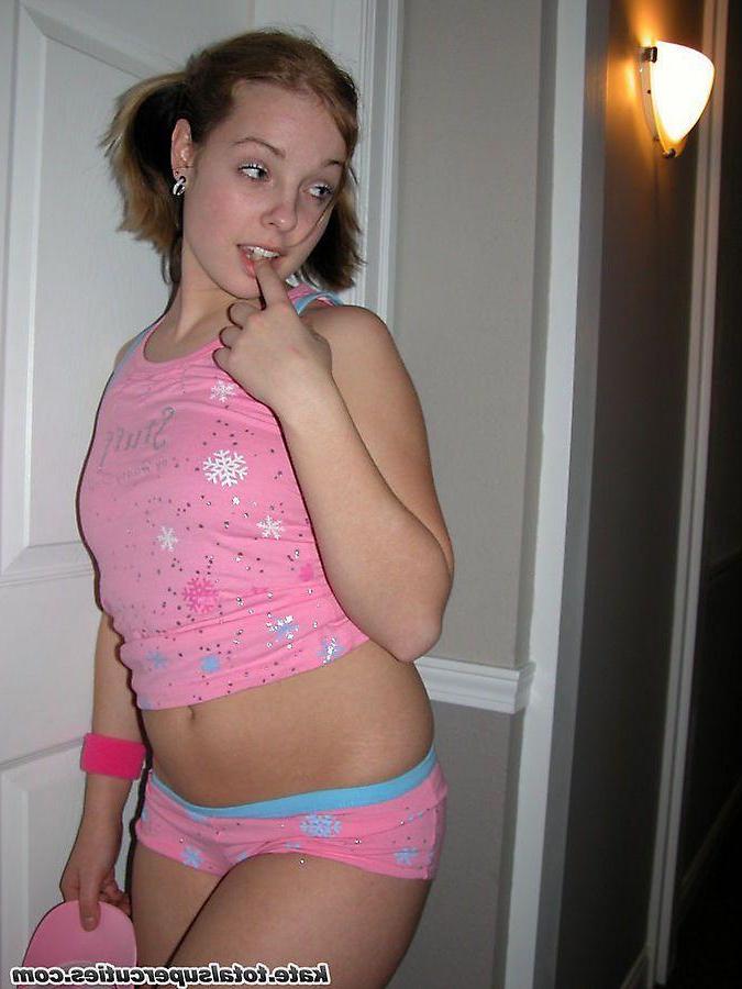 20P Pictures of teen cutie Katie being a tease in a hotel hallway