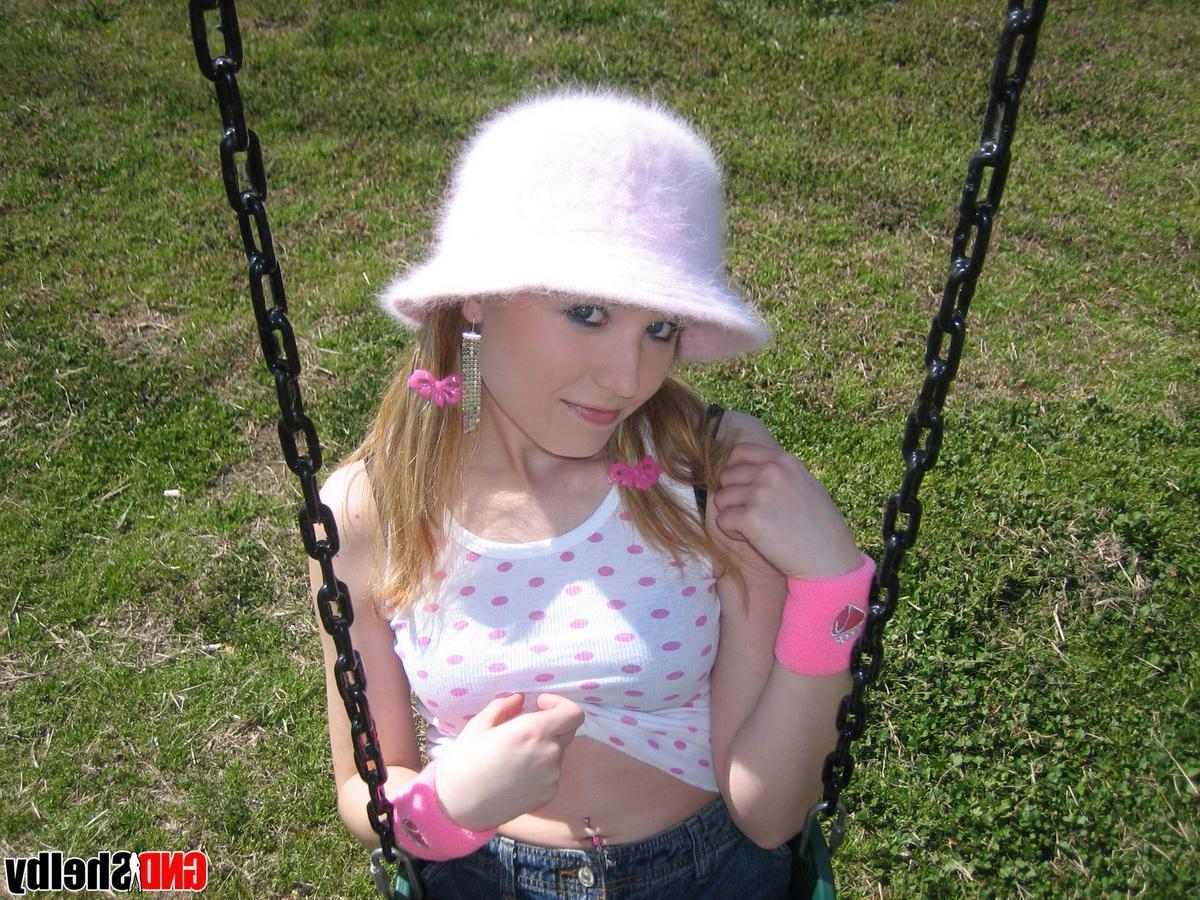 12P Teen girl Shelby teases with her perky perfect tits at the playground