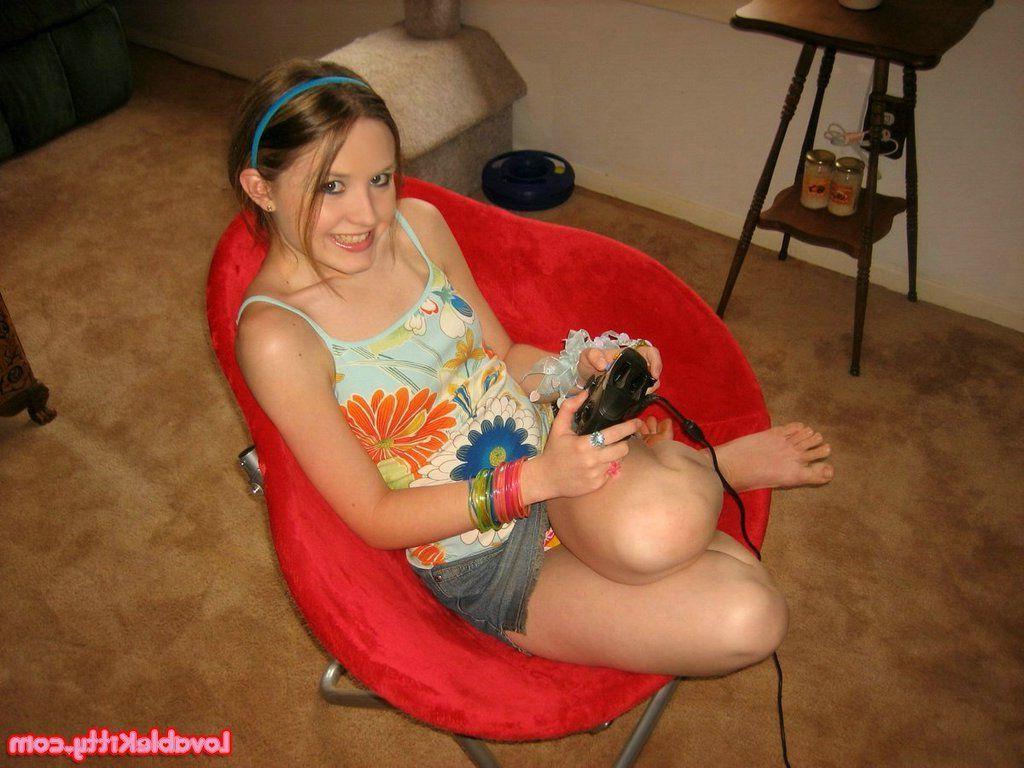 15P Pictures of teen girl Lovable Kitty getting kinky with a video game