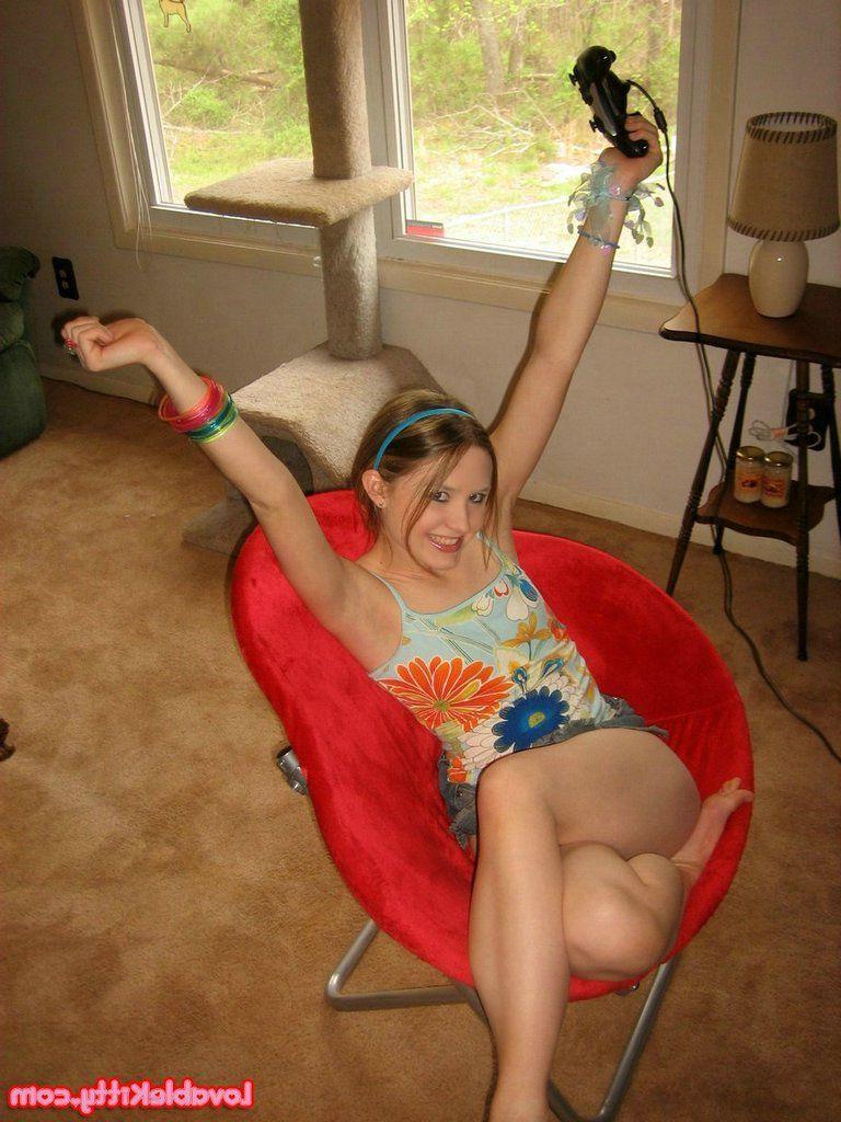 15P Pictures of teen girl Lovable Kitty getting kinky with a video game