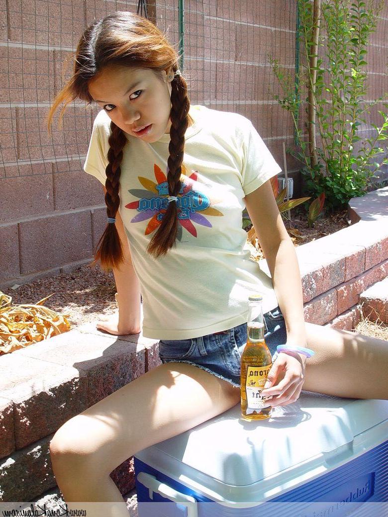 14P Pictures of teen Kona Kalani teasing in pigtails and short shorts