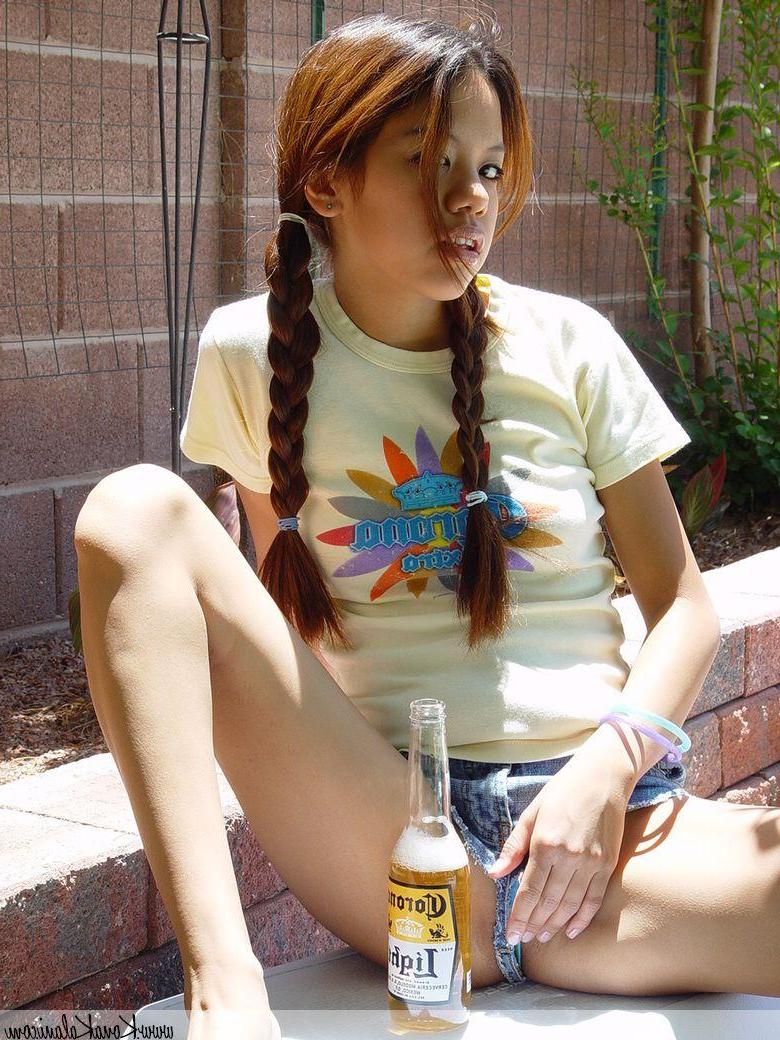 14P Pictures of teen Kona Kalani teasing in pigtails and short shorts