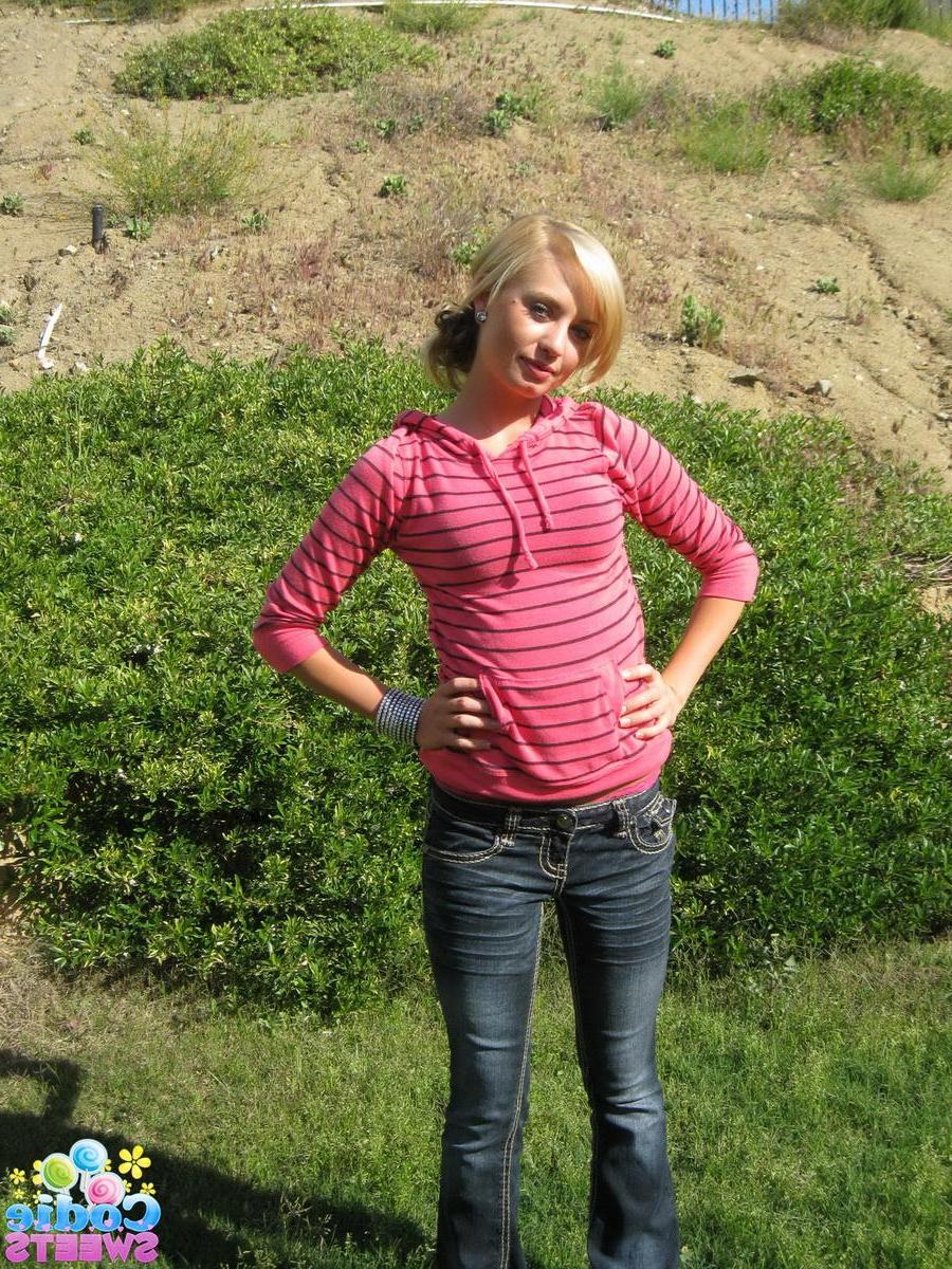12P Horny teen Codie Sweets isnt shy as she strips naked outdoors in the backyard