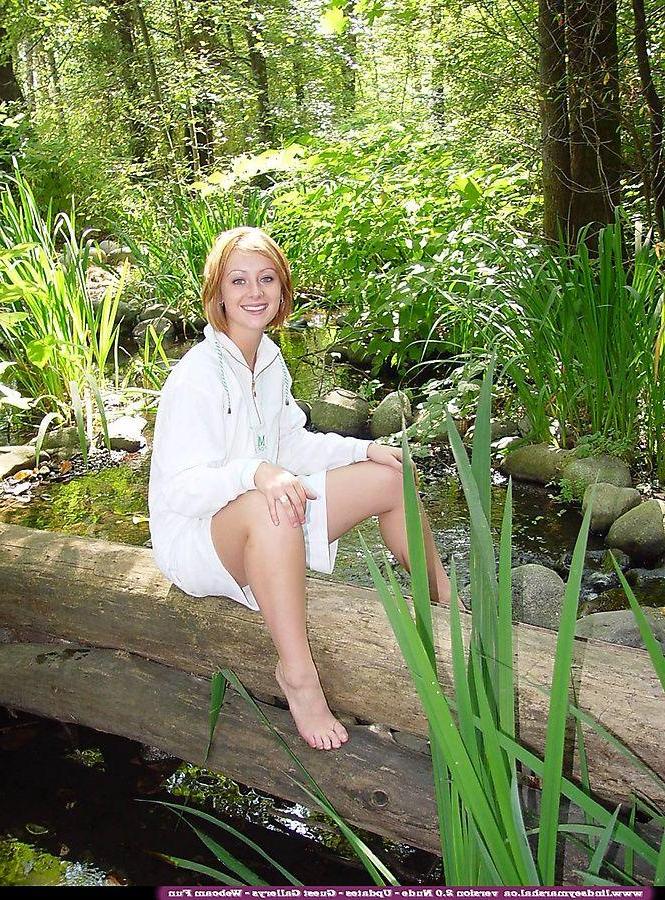 20P Pictures of teen cutie Lindsey Marshal showing her pussy in the woods