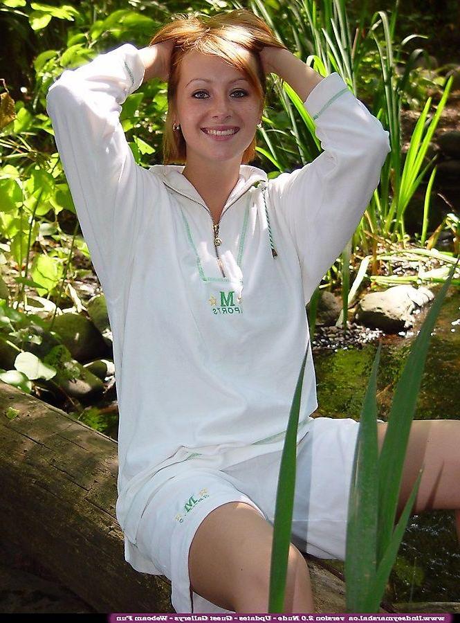 20P Pictures of teen cutie Lindsey Marshal showing her pussy in the woods