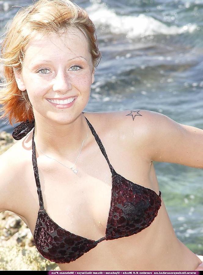 20P Pictures of Lindsey Marshal stripping nude on a beach