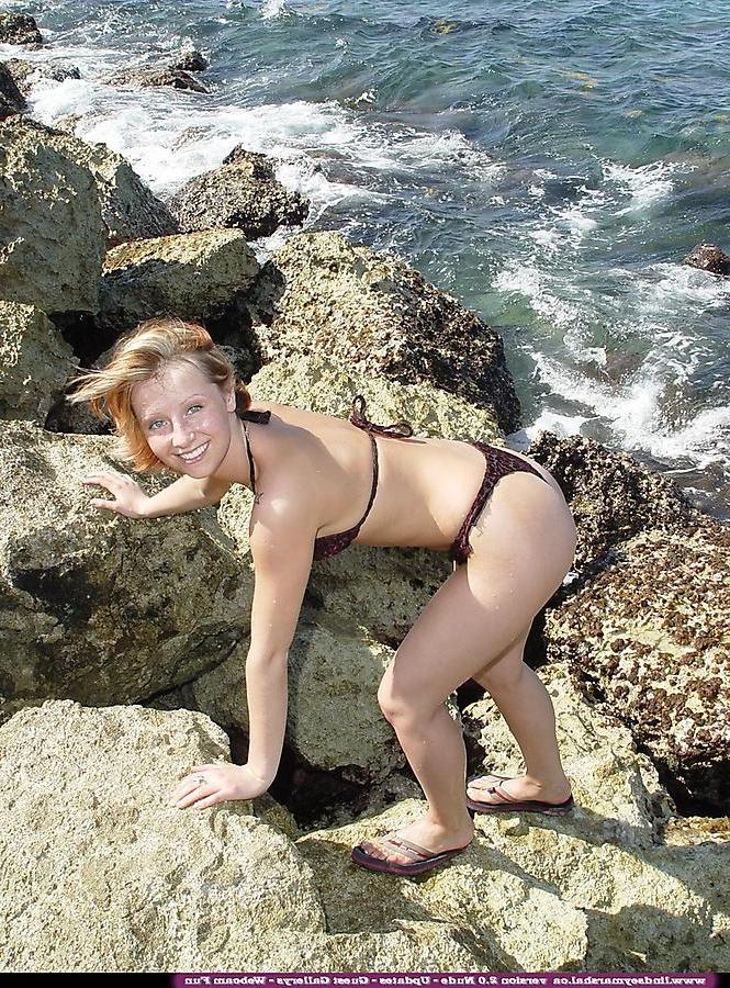 20P Pictures of Lindsey Marshal stripping nude on a beach