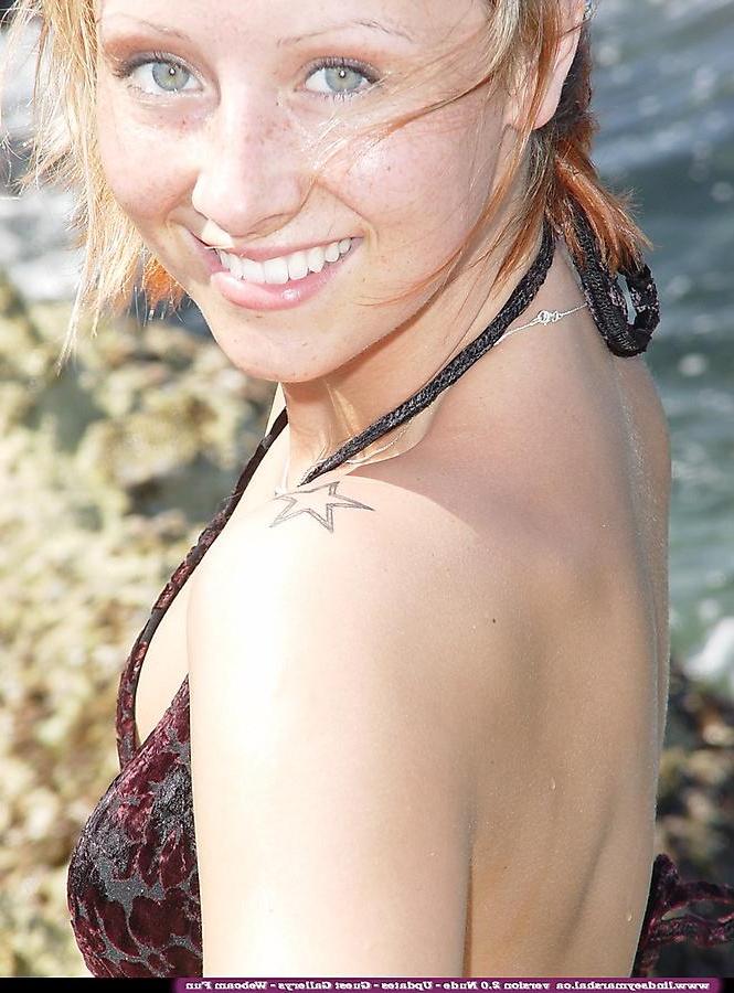 20P Pictures of Lindsey Marshal stripping nude on a beach