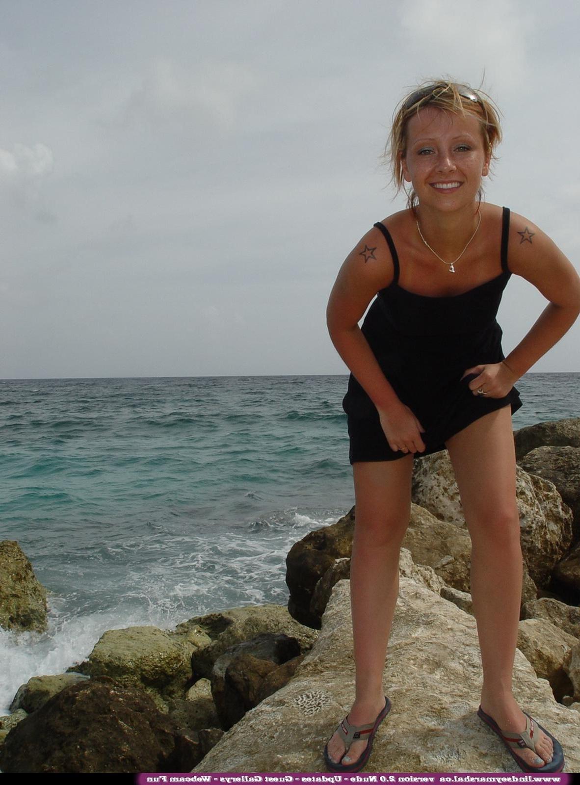 20P Pictures of teen nympho Lindsey Marshal totally nude on a beach