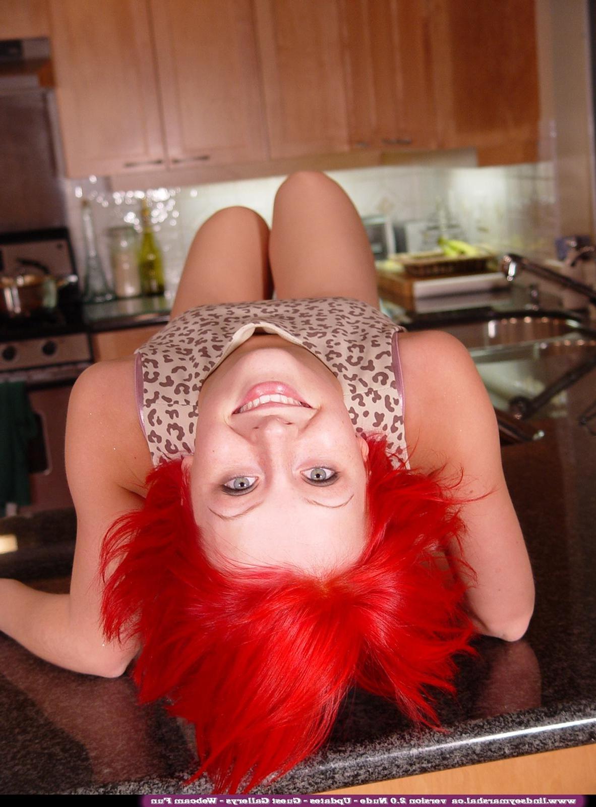 20P Pictures of Lindsey Marshal getting naked on the kitchen counter
