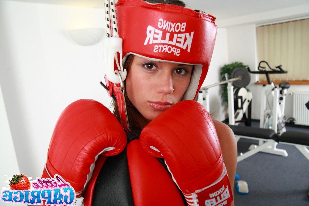 15P Pictures of Little Caprice and her friend sharing a cock in a boxing gym